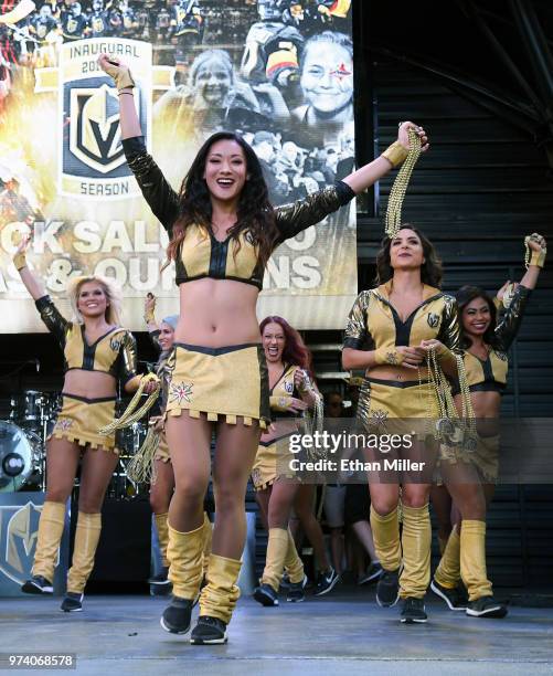 Members of the Vegas Golden Knights Golden Aces throw beads to fans during the team's "Stick Salute to Vegas and Our Fans" event at the Fremont...