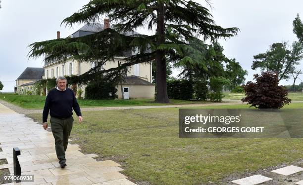 Sauternes' appellation president Xavier Planty walks in front of the chateau Guiraud on May 14, 2018 in Sauternes, western France. - A sweet wine...
