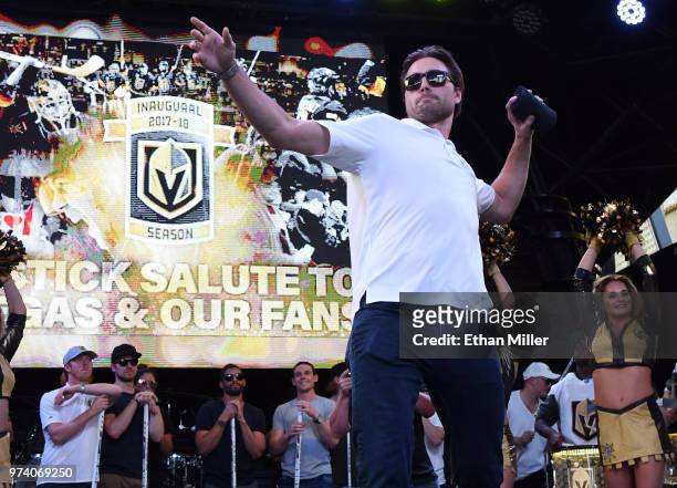 Alex Tuch of the Vegas Golden Knights throws T-shirts to the crowd as he is introduced at the team's "Stick Salute to Vegas and Our Fans" event at...