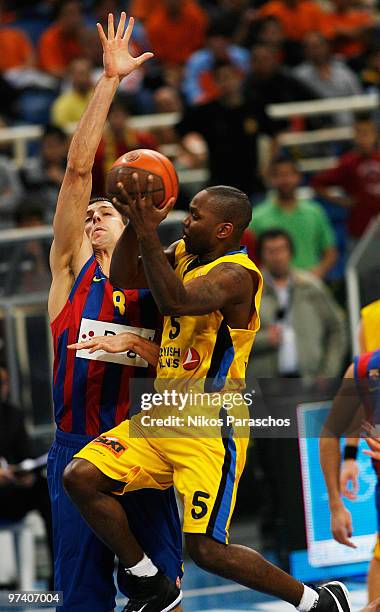 Billy Keys, #5 of Maroussi BC competes with Jordi Trias, #8 of Regal FC Barcelona during the Euroleague Basketball 2009-2010 Last 16 Game 5 between...