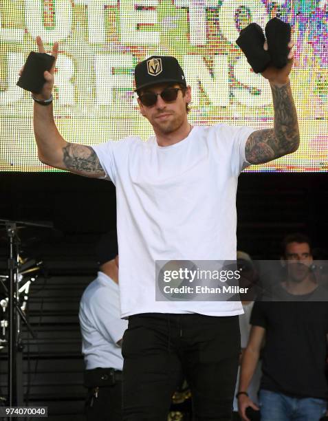 James Neal of the Vegas Golden Knights throws T-shirts to the crowd as he is introduced at the team's "Stick Salute to Vegas and Our Fans" event at...