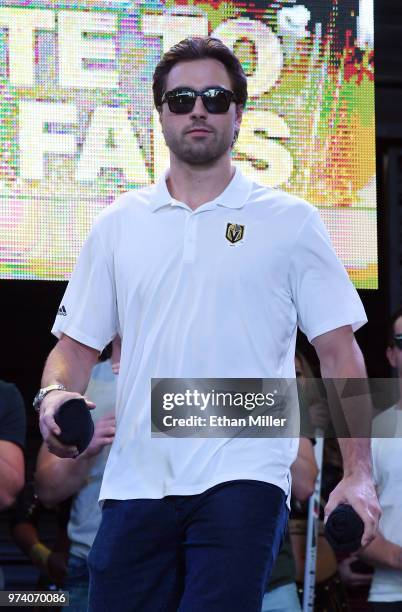 Alex Tuch of the Vegas Golden Knights throws T-shirts to the crowd as he is introduced at the team's "Stick Salute to Vegas and Our Fans" event at...