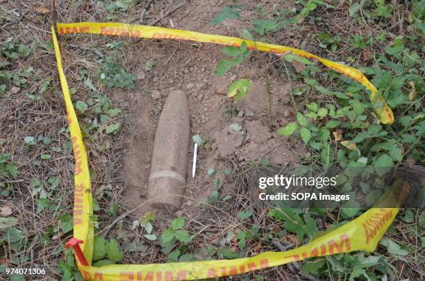 An unexploded shell is outlined with tape during a clearance operation by the Kosovo Security Force Emergency Ordinance Disposal team in Freedom Park...