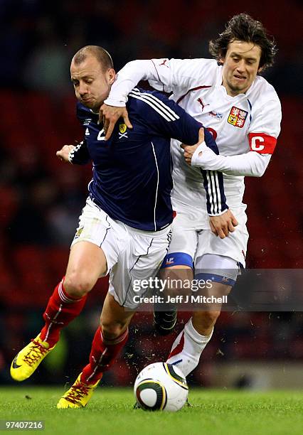 Alan Hutton of Scotland is tackled by Tomas Rosicky of Czech Republic during the International Friendly match between Scotland and the Czech Republic...