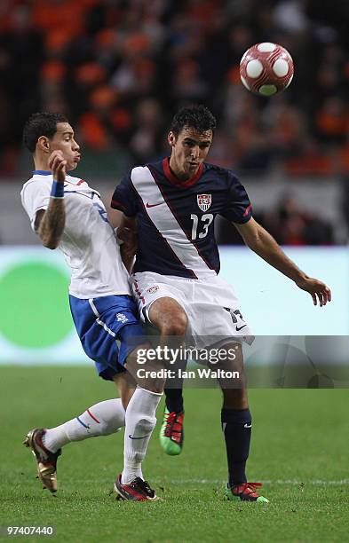 Jonathan Bornstein of USA tries to tackle Gregory Van der Wiel of the Netherland during the International Friendly between Netherlands and USA at the...