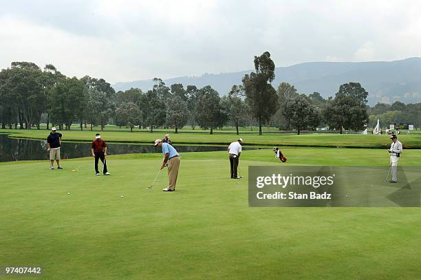 Players practice putting on the 10th green during practice for the Pacific Rubiales Bogota Open Presented by Samsung at Country Club de Bogota on...