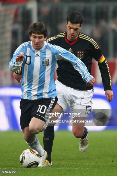 Michael Ballack of Germany tackles Lionel Messi of Argentina during the International Friendly match between Germany and Argentina at the Allianz...