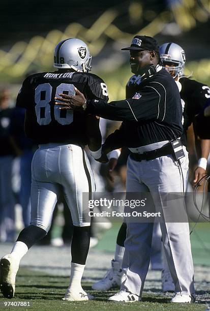 S: Head Coach Art Shell of the Los Angeles Raiders give his tight end Ethan Horton coming a pat on the back coming off the field during an NFL...