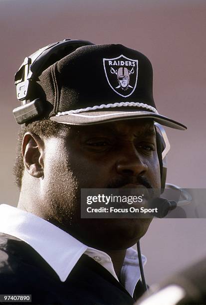 S: Head Coach Art Shell of the Los Angeles Raiders watches the action from the sidelines during an NFL football game circa early 1990's at the Los...