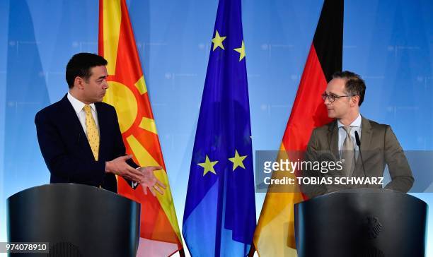German Foreign Minister Heiko Maas and his Macedonian counterpart Nikola Dimitrov give a joint press conference following talks on June 14, 2018 in...