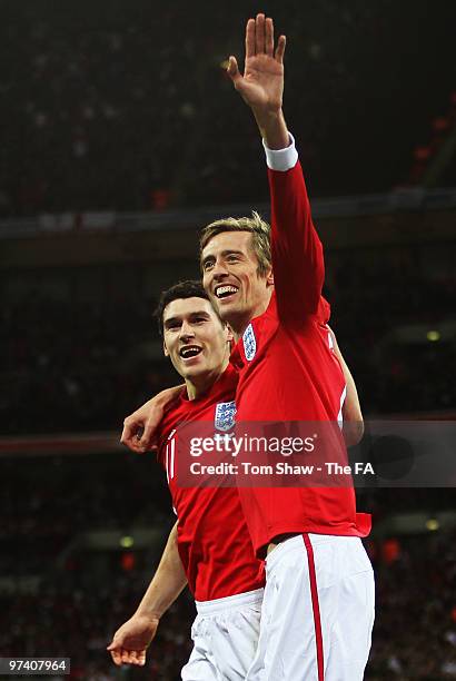Peter Crouch of England celebrates with Gareth Barry as he scores their first goal during the International Friendly match between England and Egypt...