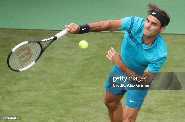 Roger Federer of Switzerland serves the ball to Mischa Zverev of Germany during day 3 of the Mercedes Cup at Tennisclub Weissenhof on June 13, 2018...