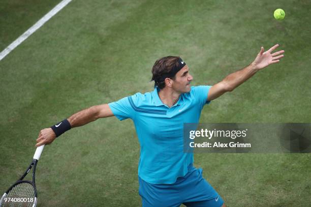 Roger Federer of Switzerland serves the ball to Mischa Zverev of Germany during day 3 of the Mercedes Cup at Tennisclub Weissenhof on June 13, 2018...