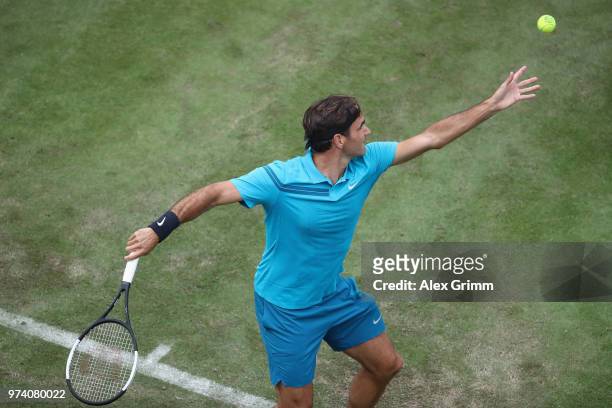 Roger Federer of Switzerland serves the ball to Mischa Zverev of Germany during day 3 of the Mercedes Cup at Tennisclub Weissenhof on June 13, 2018...