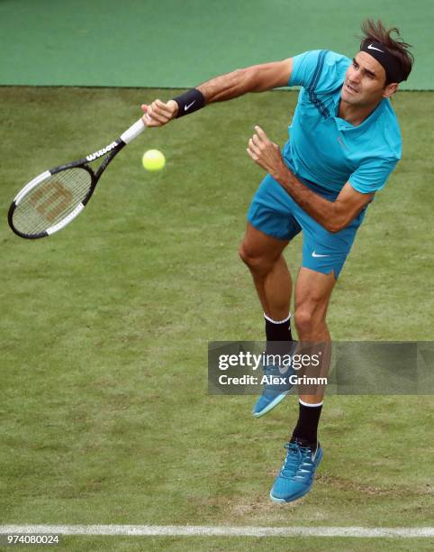 Roger Federer of Switzerland serves the ball to Mischa Zverev of Germany during day 3 of the Mercedes Cup at Tennisclub Weissenhof on June 13, 2018...