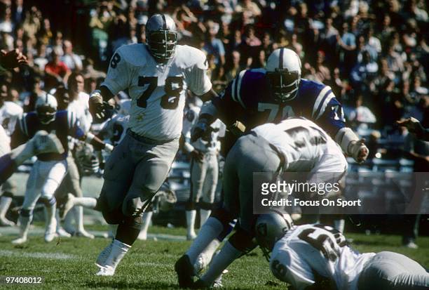 Offensive tackle Art Shell of the Oakland Raiders in action as Ken Novak of the Baltimore Colts sacks Quarterback Ken Stabler December 24, 1977...