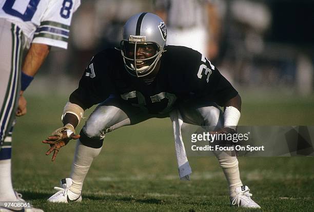 S: Defensive back Lester Hayes of the Oakland Raiders in action guarding wide receiver Steve Largent of the Seattle Seahawks circa early 1980's...