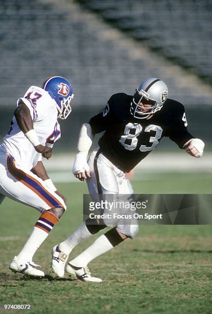 S: Linebacker Ted Hendricks of the Los Angeles Raiders in action guarding tight end James Wright of the Denver Broncos circa early 1980's during an...