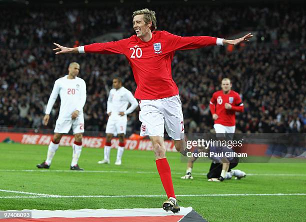 Peter Crouch of England celebrates as he scores their first goal during the International Friendly match between England and Egypt at Wembley Stadium...