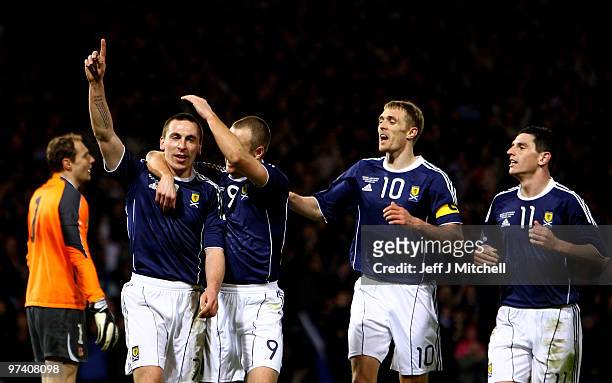 Scott Brown of Scotland celebrates with Kenny Miller, Darren Fletcher and Graham Dorrans after scoring during the International Friendly match...
