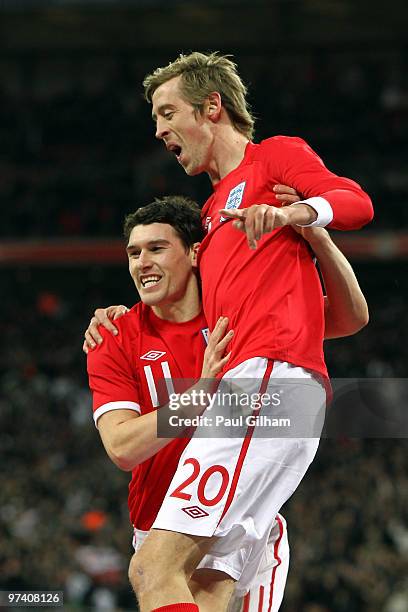 Peter Crouch of England celebrates with Gareth Barry as he scores their first goal during the International Friendly match between England and Egypt...