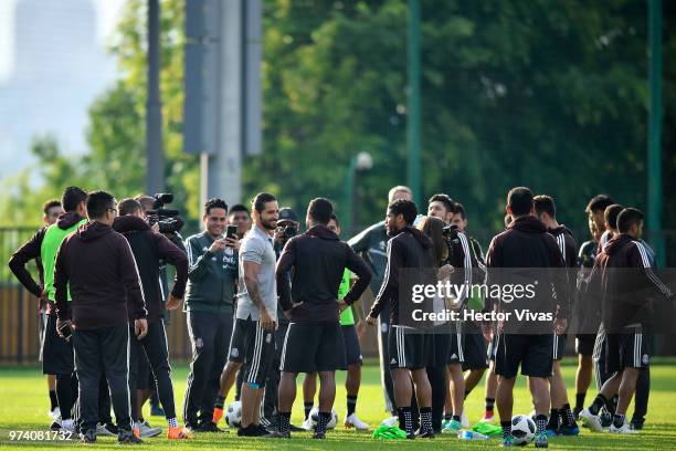 Singer Maluma talks with players of Mexico team during a training session at FC Strogino Stadium on June 12, 2018 in Moscow, Russia.