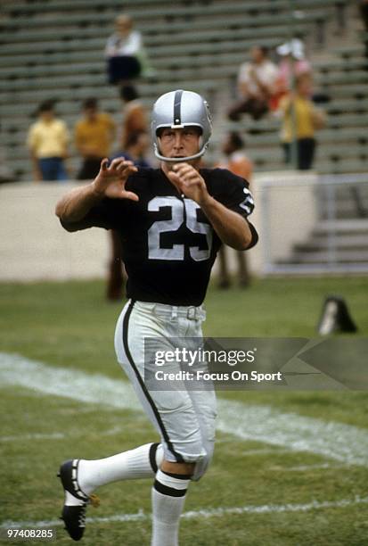 Wide Receiver Fred Biletnikoff of the Oakland Raiders on the field during pre-game warm-up circa 1973 before an NFL football game at Cal Memorial...