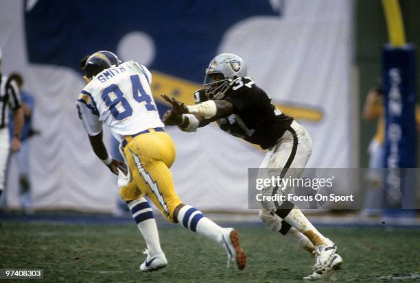 S: Defensive back Lester Hayes of the Oakland Raiders in action guarding wide receiver Ron Smith of the San Diego Chargers circa early 1980's during...