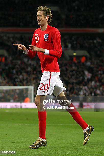 Peter Crouch of England celebrates as he scores their third goal during the International Friendly match between England and Egypt at Wembley Stadium...