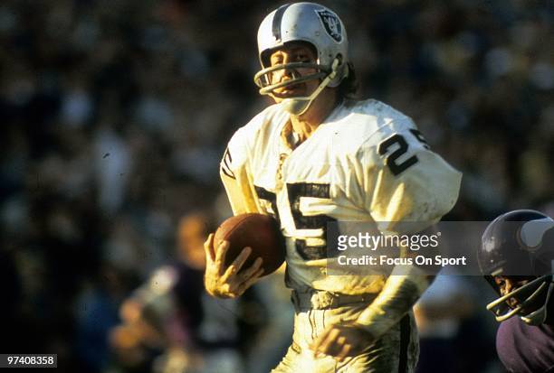 Wide Receiver Fred Biletnikoff of the Oakland Raiders in action races towards the endzone against the Minnesota Vikings during Super Bowl XI on...