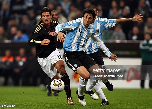 Mario Gomez of Germany and Nicolas Burdisso of Argentina compete for the ball during the International Friendly match between Germany and Argentina...