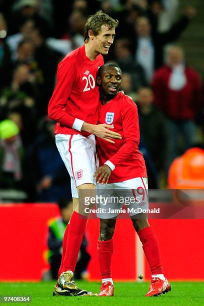 Shaun Wright-Phillips of England celebrates with Peter Crouch as he scores their second goal during the International Friendly match between England...