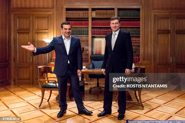 Greek Prime Minister Alexis Tsipras welcomes European Commission Vice President Valdis Dombrovskis in Maximos Mansion in Athens on June 14, 2018.