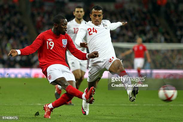 Shaun Wright-Phillips of England beats Mohamed Abdel-Shafy of Egypt during the International Friendly match between England and Egypt at Wembley...