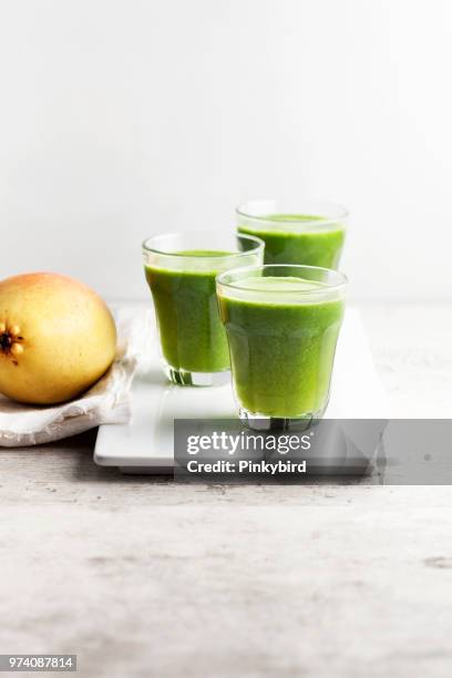 green smoothie - vegetable juice stock pictures, royalty-free photos & images