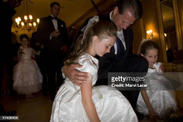 Fathers accompany their daughters as they place a white rose representing purity at the foot of the cross on May 16, 2008 in Colorado Springs,...