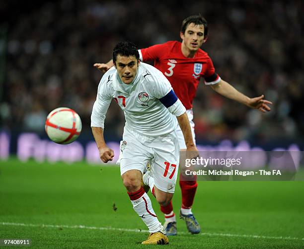 Ahmed Hassan of Egypt and Leighton Baines of England runs for the ball during the International Friendly match between England and Egypt at Wembley...