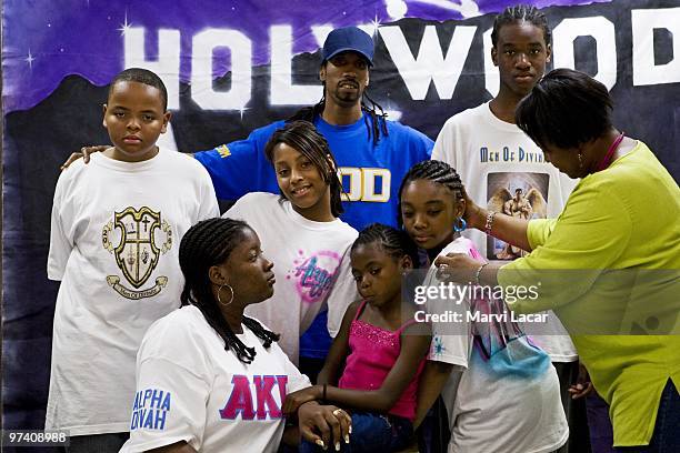 Julian Tisdale Jeffrey James, Te'Quan McCoy Ashli McCoy Kennae Tisdale Ebony Montgomery, 10 and Rhonda Moore pose for photographer Denise Gray during...