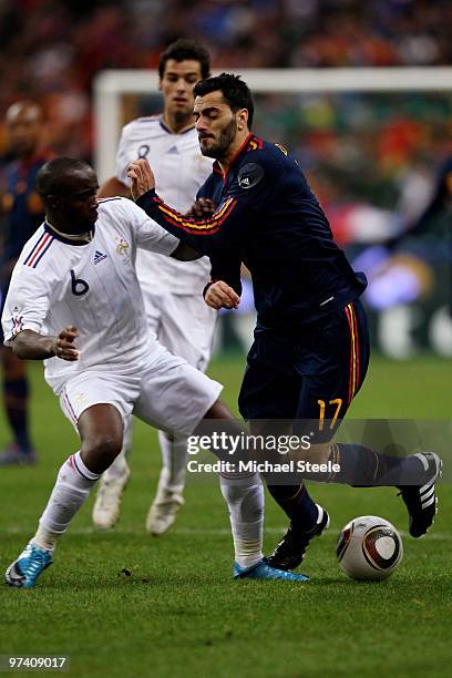 Lassana Diarra of France challenges Daniel Guiza during the during the International friendly match betweem France and Spain at the Stade de France...