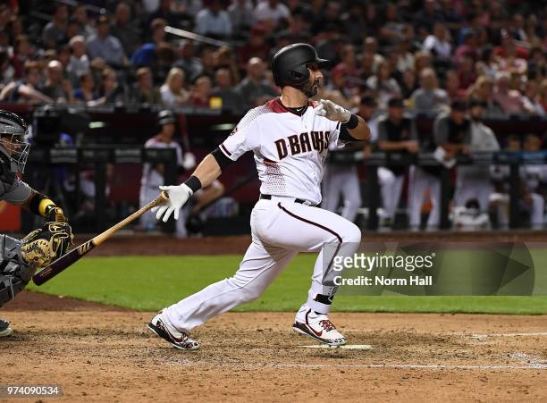 Daniel Descalso of the Arizona Diamondbacks follows through on a swing against the Pittsburgh Pirates at Chase Field on June 11, 2018 in Phoenix,...