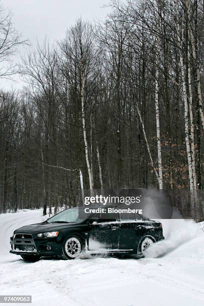 Mitsubishi Lancer Evolution MR is driven on a snowy track at Team O'Neil Rally School & Car Control Center in Dalton, New Hampshire, U.S., on Friday,...