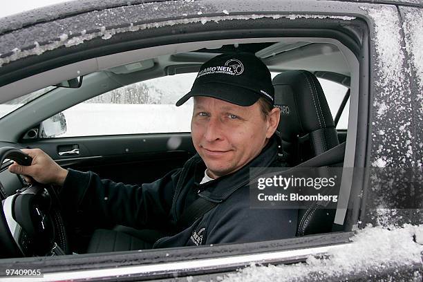 Tim O'Neil, a five-time champion American rally driver and owner of Team O'Neil Rally School & Car Control Center, sits in a 2010 Mitsubishi Lancer...
