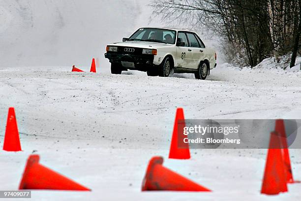 An Audi rally car maneuvers between cones on a snowy track at Team O'Neil Rally School in Dalton, New Hampshire, U.S., on Friday, Feb. 19, 2010. The...