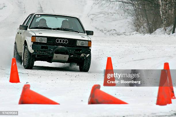 An Audi rally car maneuvers between cones on a snowy track at Team O'Neil Rally School in Dalton, New Hampshire, U.S., on Friday, Feb. 19, 2010. The...