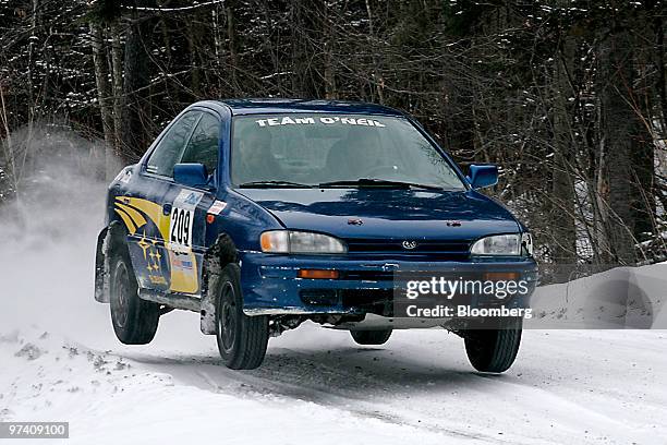 Tim O'Neil, a five-time champion American rally driver and owner of Team O'Neil Rally School & Car Control Center, drives a Subaru rally car over a...