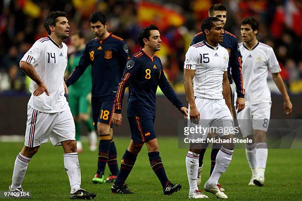 Jeremy Toulalan, Florent Malouda and Yoann Gourcuff of France walk off dejectedly at the final whistle of the France v Spain International Friendly...