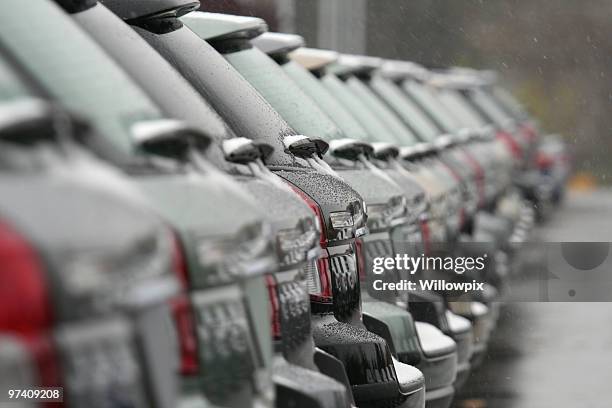 unsold cars for sale in winter falling snow - car sale stockfoto's en -beelden