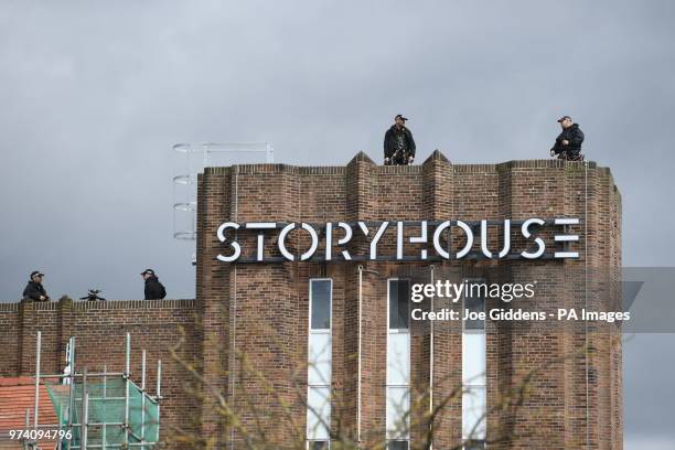 Police on the roof of Storyhouse in Chester ahead of the visit of Queen Elizabeth II and the Duchess of Sussex to Chester Town Hall, Chester for a...