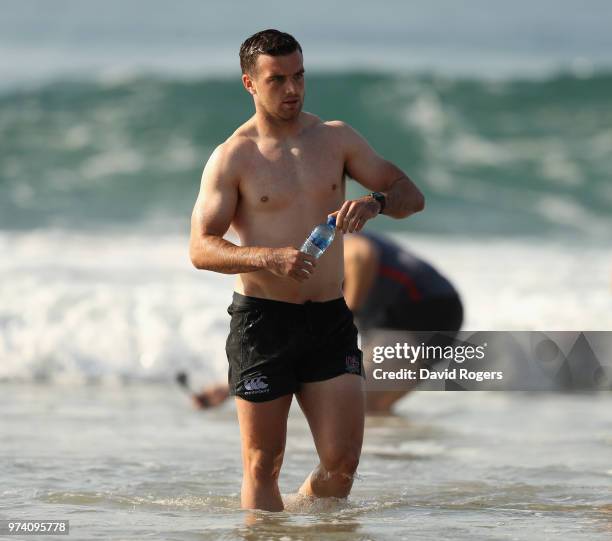 George Ford walks out of the Indian Ocean during the England recovery session held on the beach on June 14, 2018 in Umhlanga Rocks, South Africa.