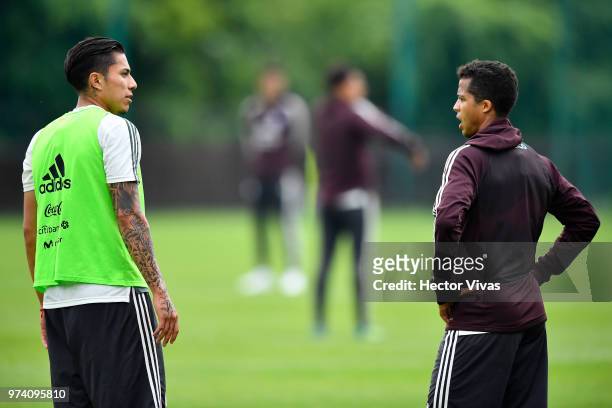 Carlos Salcedo and Giovani dos Santos of Mexico talk during a training session at FC Strogino Stadium on June 12, 2018 in Moscow, Russia.